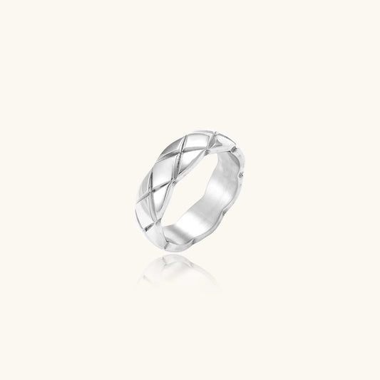 Braided stainless steel band ring with geometric interwoven strands in brushed silver finish on white background